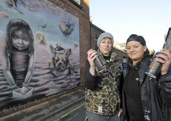 Joy Gilleard and Hayley Garner from Nomad Clan with their artwork on Back St Annes Road West