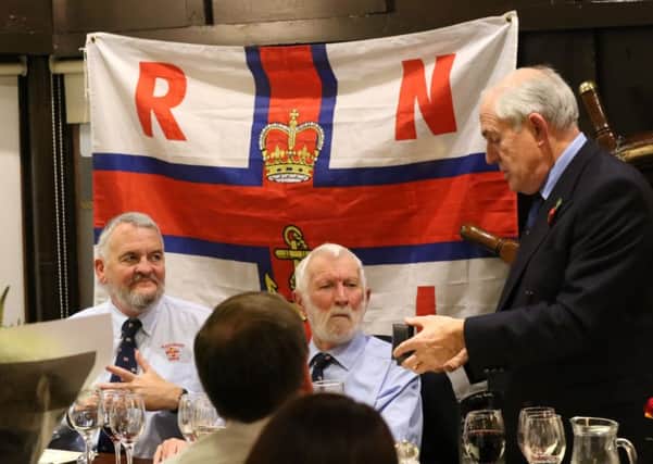 Capt Peter Woodworth (centre) chairman of Fleetwood Lifeboat branch, receives an award from Michael Vlasto OBE (right), retired operations director of the RNLI, while Fleetwood operations director Capt Dave Eccles (left) looks on.