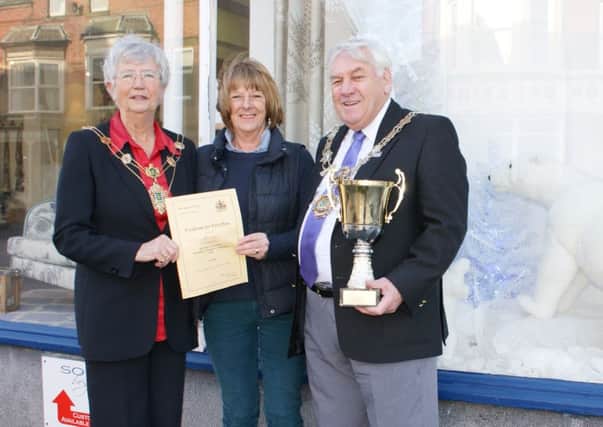 Soper's window dresser Johanne Cross receives the 2015 Fylde mayor's best Christmas window award from then mayor Coun Peter Hardy and mayoress Sheila Hardy