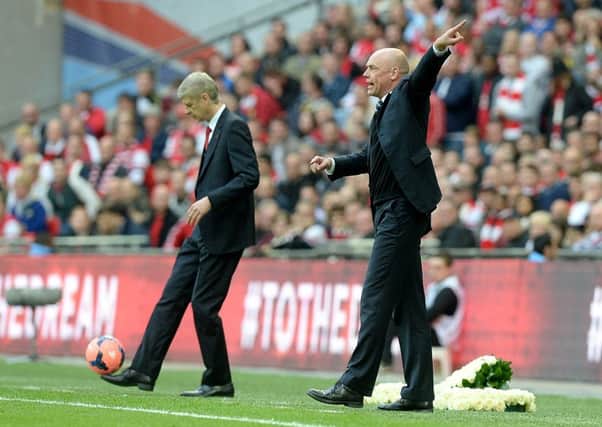 Uwe Rosler pitting his wits against Arsene Wenger in the FA Cup in 2014