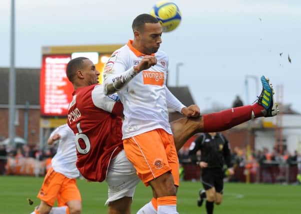 FA Cup 3rd round tie between Fleetwood Town and Blackpool FC. Fleetwood's Nathan Pond puts in a timely clearance from Matt Phillips. PIC BY ROB LOCK 07-01-12