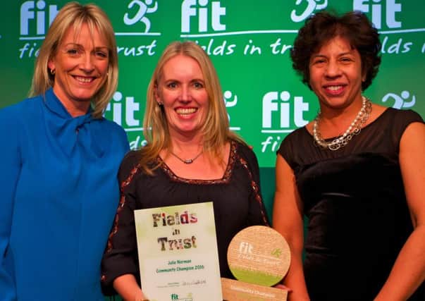 Julie Norman of Park View 4U, Lytham receives her Fields in Trust community champion award from Annette Byron of  law firm Freshfields, Bruckhaus Deringer a corporate supporter of Fields in Trust (left) and broadcaster Jill Douglas.