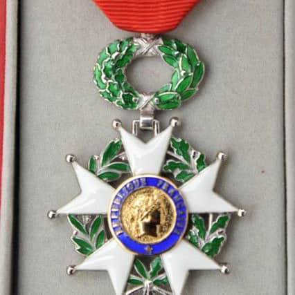 Picture by Julian Brown 06/12/16

The medal given to Ernie

Ernie Lee, 92, who has been awarded a military medal, the Legion D'Honneur medal by the French government pictured at his Fleetwood home.