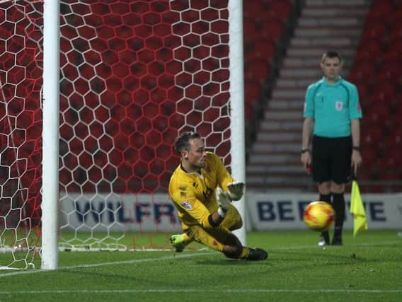 Dean Lyness makes the crucial penalty save