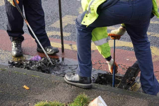 The two council workers used tools search the drains in Lytham Road, South Shore, close to where a man was stabbed