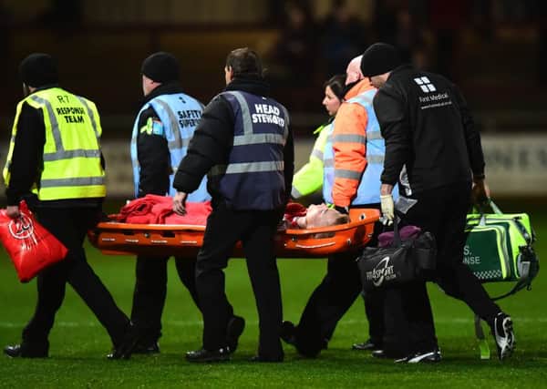 Fleetwood Town's Kyle Dempsey is stretchered off