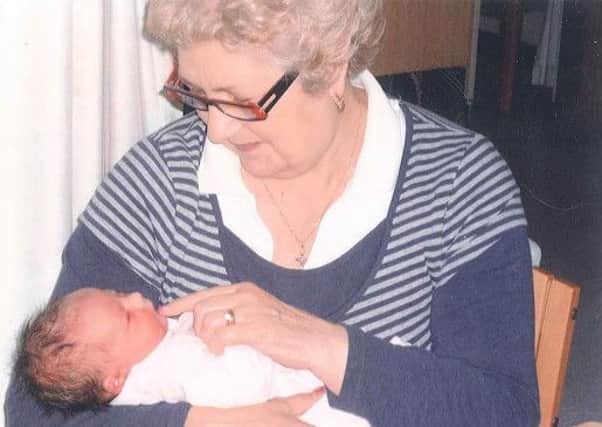Patricia holding her granddaughter Ruby in 2009