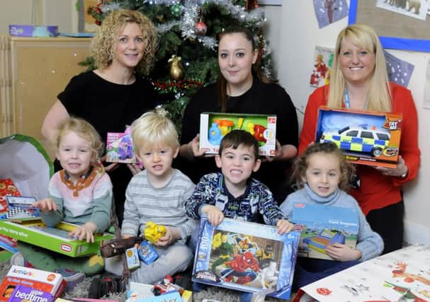 Katie Simmons and Sarah Nuttall from the nursery with Nicci Hayes from Blue Skies and children Jesse Neary, Ralph Ingle, Sonny Reidy and Lily Elgendy
