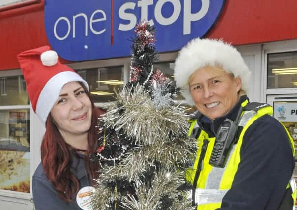 PCSO Linda Stackhouse at the One Stop collecting for the Wish Tree Appeal. She is pictured with Jenny Bywater from One Stop.