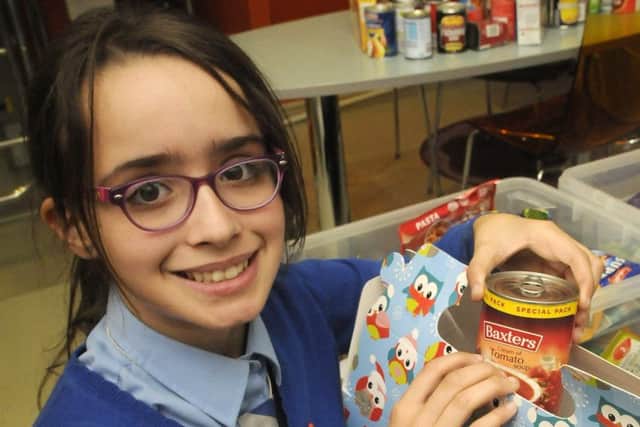Samira Dorrington packing food for the homeless this Christmas