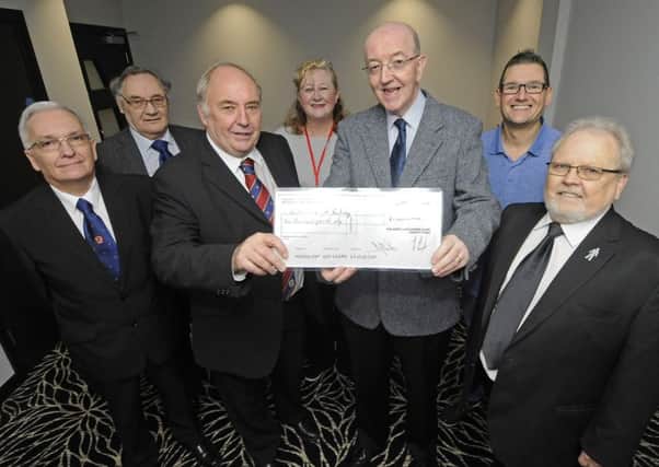 Poulton and Wyre Railway Society receive a cheque for Â£1000 from fundraising community groups.  Pictured L-R are Jimmy Rogers, Mike Casey, Peter Williams, Mary Stirzaker, Alan Fairhurst, Eddie Fisher and Bob Walker.