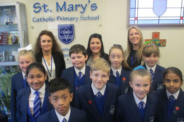 Pupils of St Mary's Catholic Primary School in Fleetwood with (from lef) Margaret Bottomley (deputy head), Cat Sewell (head of Year 6) and head teacher Ann Kowalska.