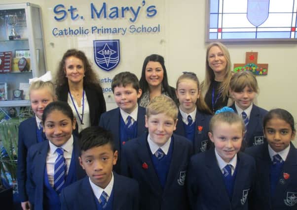 Pupils of St Mary's Catholic Primary School in Fleetwood with (from lef) Margaret Bottomley (deputy head), Cat Sewell (head of Year 6) and head teacher Ann Kowalska.