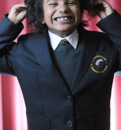 Shakespeare Primary pupil six-year-old Adrian Prasad gets his hair cut by mum Chamila Fonseka for charity