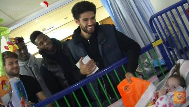 Blackpool FC player Kelvin Mellor meets with a young patient at Blackpool Vic