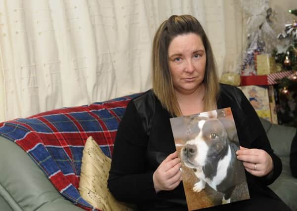 A family have been left devastated after finding thier pet dog Rosie had been left to die by it's new owner.  Pictured is Zoe Hargreaves.