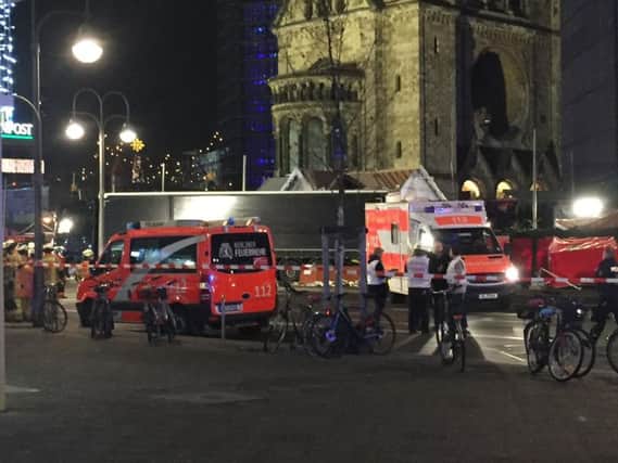 Emergency services at the scene where a truck ploughed into a crowded Christmas market outside the Kaiser Wilhelm Memorial Church in Berlin