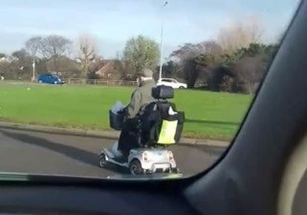 The pensioner was filmed on his scooter tackling the Morrisons roundabout on Amounderness Way (Pic: Facebook/Kevin Green)