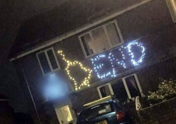 Offensive christmas lights at a house in Grange Park