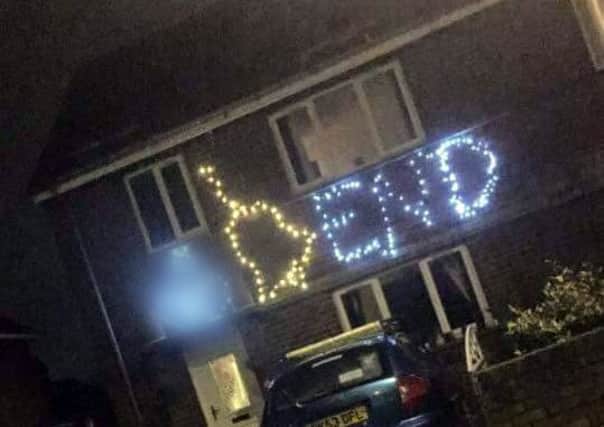 Offensive christmas lights at a house in Grange Park