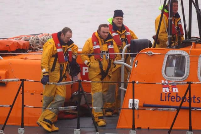 Fleetwood lifeboat returns carrying wreckage from the civil helicopter.
