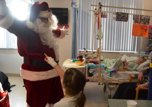 Santa meets the children at Blackpool Vic's childrens ward. Picture from Blackpool Victoria Hospital