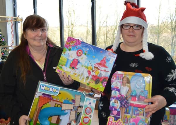 Sue Ridley and Michelle Green with some of the donated toys