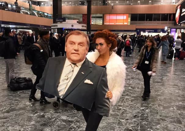 Charlotte carried a cardboard cut-out of her dad Les through Euston station
