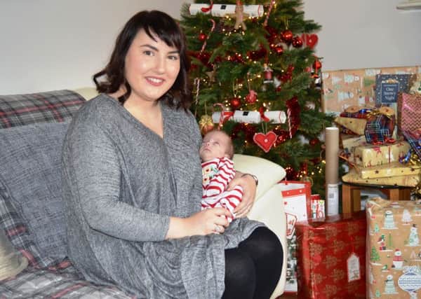 Rac hel Morris with baby Edgar at their home in Lytham