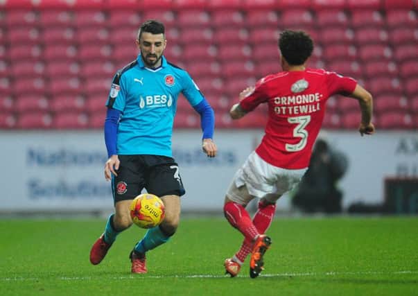 Conor McLaughlin in action for Fleetwood at Swindon