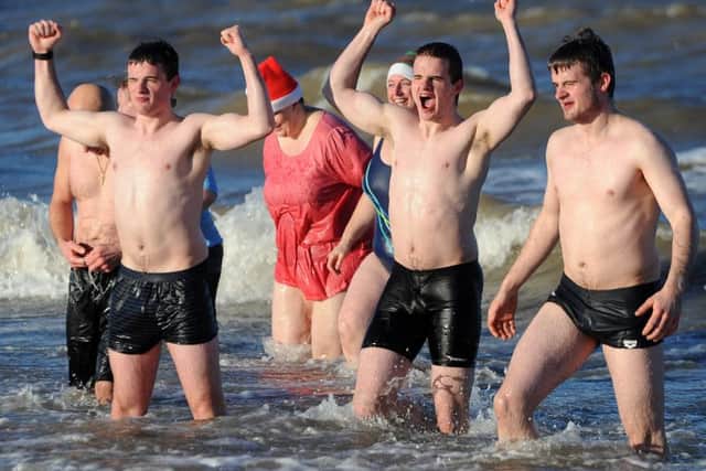 Hardy fundraisers braved the freezing waters off Fleetwood for the annual New Year's Day dip.
Cold? Nothing to it.  PIC BY ROB LOCK
1-1-2017