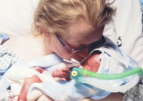 Louise Searle and Andrew Bayliss lost their son Olliey-J Searle-Bayliss when he was just two days old.  They are now trying to raise funds for a headstone.