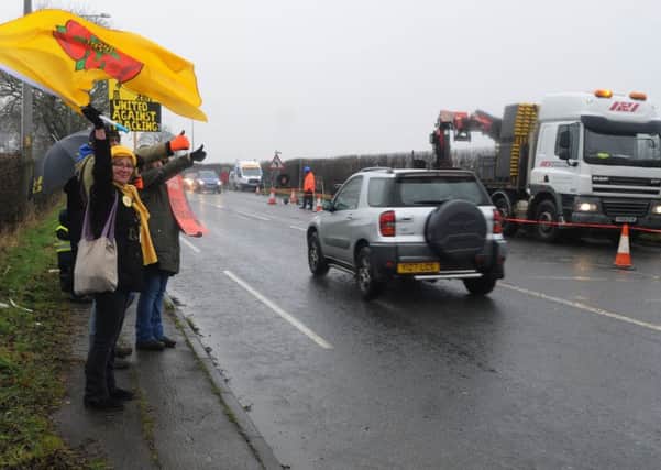 A group of protesters gather across from a new fracking site, off A583, Preston New Road, Little Plumpton.