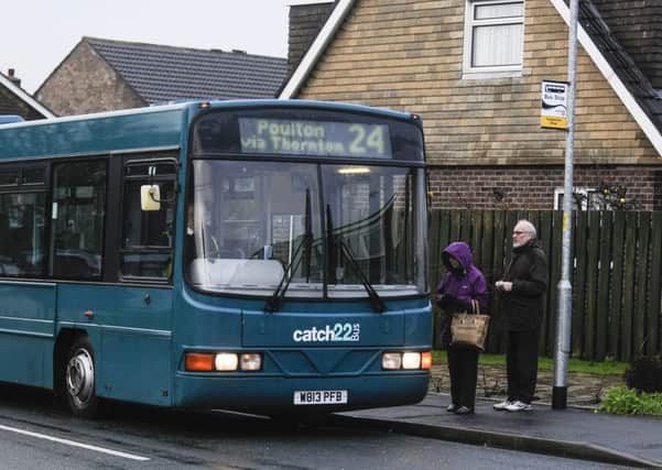 A Catch22bus stops to pick up passengers