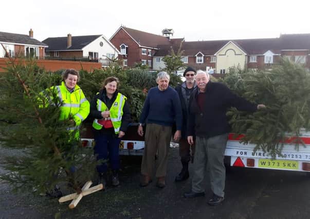 Coun Tony Ford and Coun Carol Lanyon with St Annes In Bloom volunteers collecting discarded Christmas trees