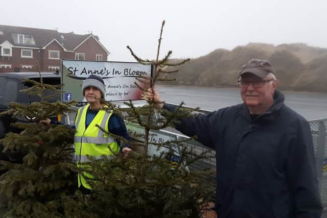 St Annes In Bloom volunteers Eric and Val Gaskell collecting discarded Christmas trees