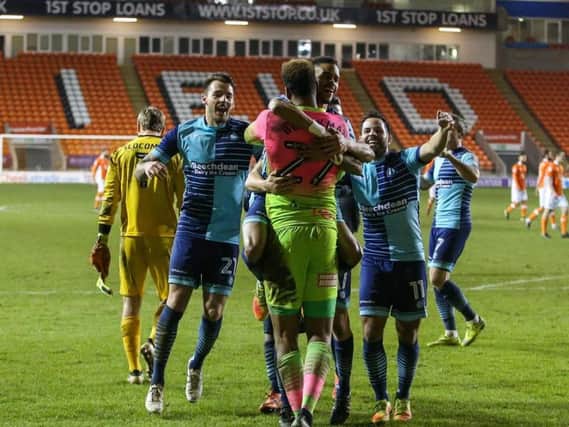 Wycombe players celebrate after their penalty shootout win.