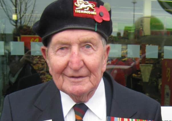 Eddie Holt, out collecting for the Poppy Appeal.