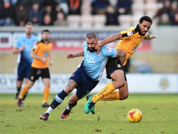 Kyle Vassell tussles for the ball
