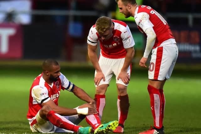 Fleetwood Town's Nathan Pond reacts to an injury