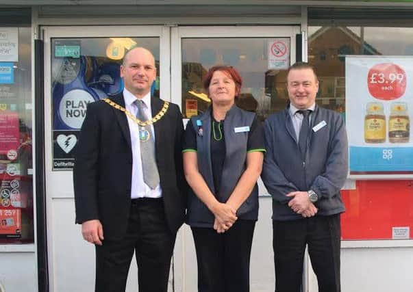 Coun David Angel, chairman of Staining Parish Council, Christine Eastwood and Co-op manager Stuart Cook.