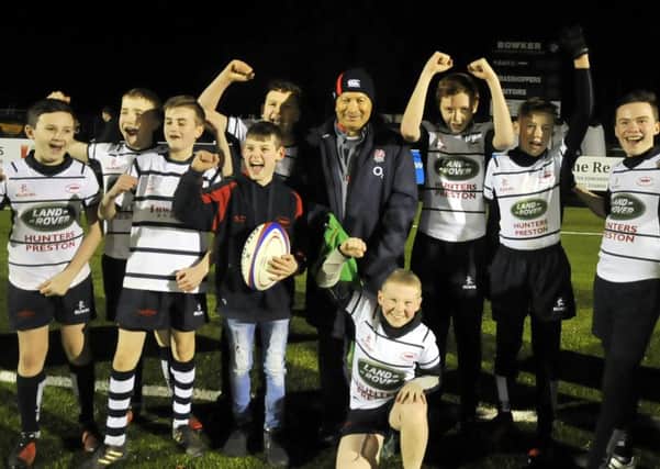 Eddie Jones gets a big cheer from the youngsters