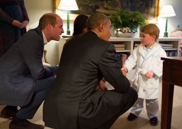 Prince George  meeting the President of the United States Barack Obama (centre) and First Lady Michelle Obama (behind) at Kensington Palace, London, with the Duke of Cambridge (left), after the US president visited the UK to congratulate the Queen on turning 90 in April.