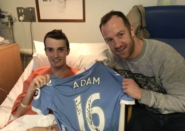Former Pool midfielder Charlie Adam visited Poulton teen Andrew Sanderson in hospital after he was hurt in a hit and run (Picture: Twitter/@AJSanderson9)