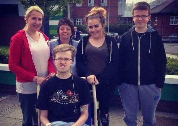 Callum Evans with his family at Wythenshawe Hospital
