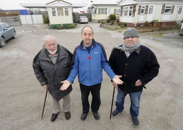 Residents at Windmill Caravan Park fear they could lose their homes following a planning application for a drive-thru by the nearby petrol station.  Pictured L-R are Ralph Carter, Steven Roy Gratrix and Terry Duran from the Windmill Park Residents Association.