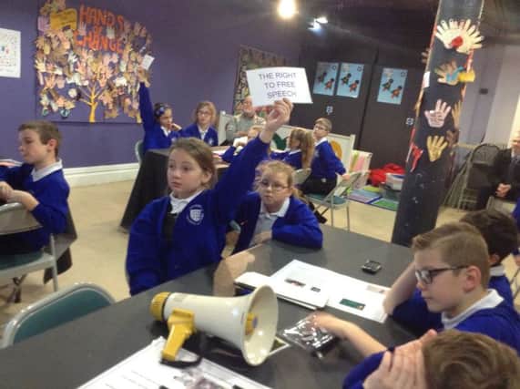Children from St Cuthbert's Catholic Academy learning about slavery at a Liverpool museum