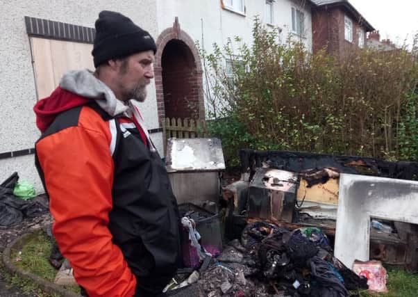 David Crossfield, 61, outside his London Road home which was seriously damaged by a fire