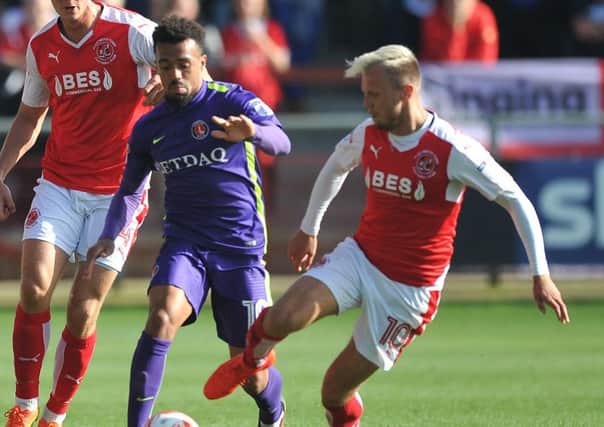 Fleetwood Town's David Ball goes in on Charlton Athletic's Nicky Ajose