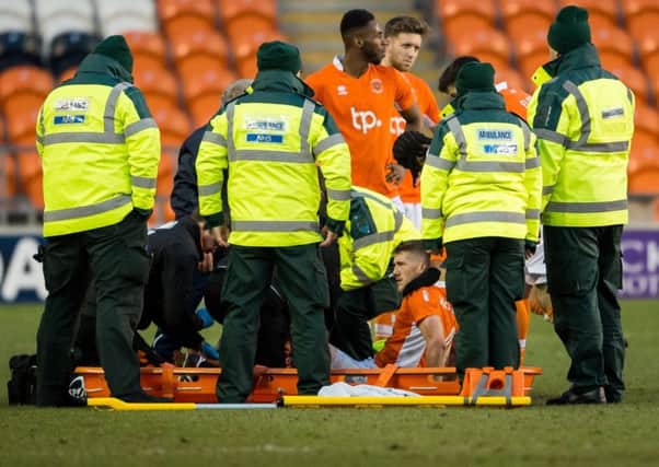 Jim McAlister is stretchered off